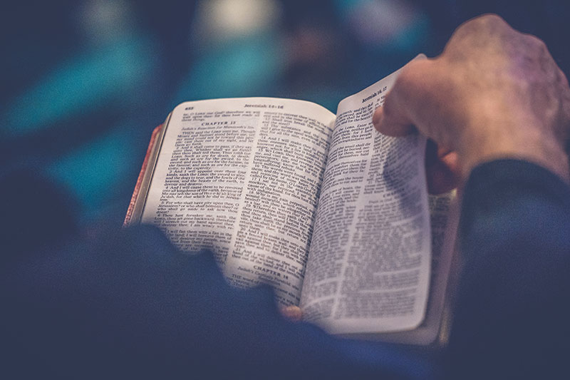 An open Bible on a desk